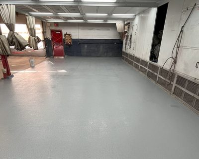 Repair of a car body shop garage slab and waterproofing